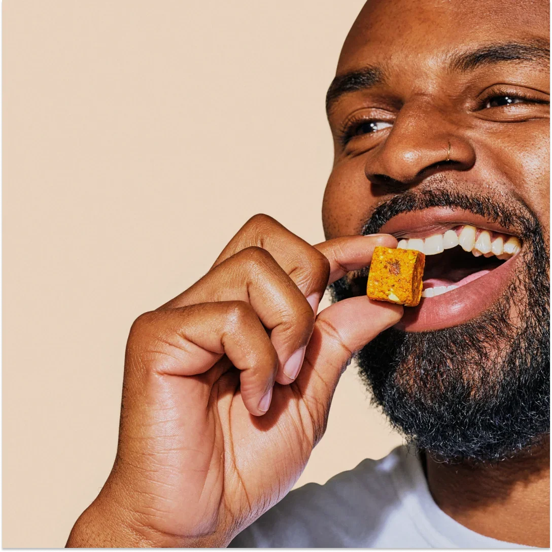 Person eating a GEM Bite